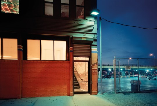 West 126th Street, New York“I am intrigued by the variety of colors of light falling on the building and the adjacent parking lot. The abrupt combination of warm and cool light is a characteristic I frequently see as night falls.” -- Lynn Saville