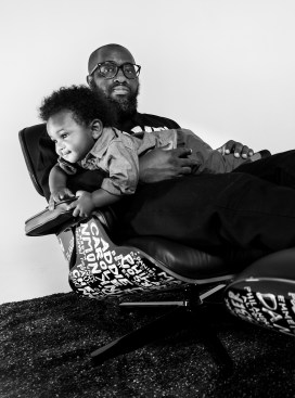 Mike Ford and his son seek momentary refuge in his Eames Lounge Chair remix.