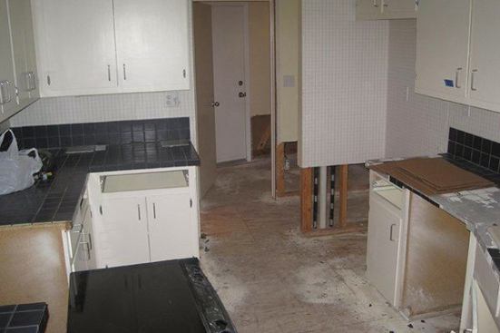 Prior to the renovation, flood damage from burst pipes had wreaked havoc on the existing closed-in kitchen.