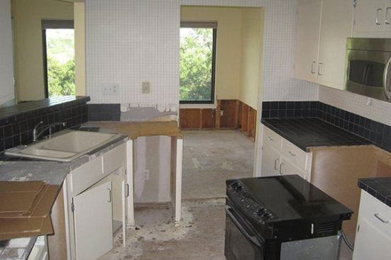 Before the renovation, pass-through walls separated the kitchen from the dining room and living room.