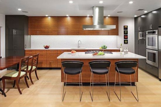 The new kitchen provides an open flow from the kitchen to the dining room, plus room for additional seating at the island. The judges praised the material changes and open layout.