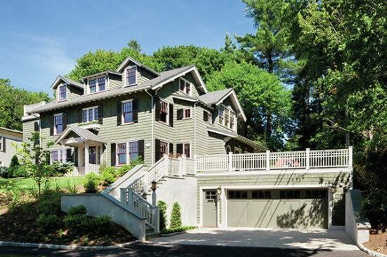 The project involved major changes to the exterior of the house and landscaping. An addition to the back expanded the kitchen and the second floor master suite and also added a mudroom and a breakfast area. The enlarged garage was topped with a green roof.