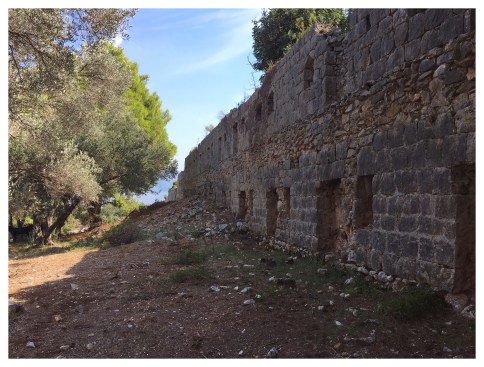 The fortress-like wall of an abandoned lazaretto on Lokum, an island off the coast of Dubrovnik