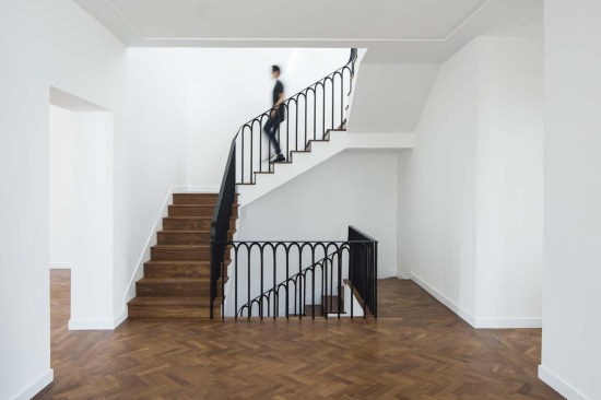 A large central stairwell leads to multiple levels of rooms featuring loggias to view the expansive Guatemalan landscape surrounding this 6,000-square-foot residence in Guatemala City.