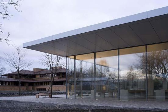 Toshiko Mori and Arup lighting fashion a respectfully glowing visitor center for frank Lloyd Wright's Darwin D. Martin house.