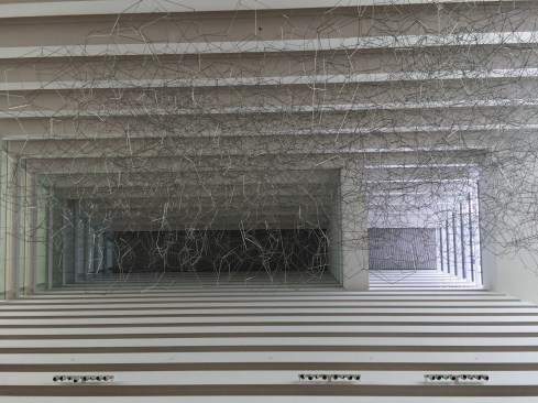 Looking up into the volume of one of three towers comprising the Marina Bay Sands hotel.