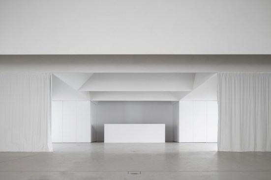 Meeting room interior with room-dividing curtains deployed
