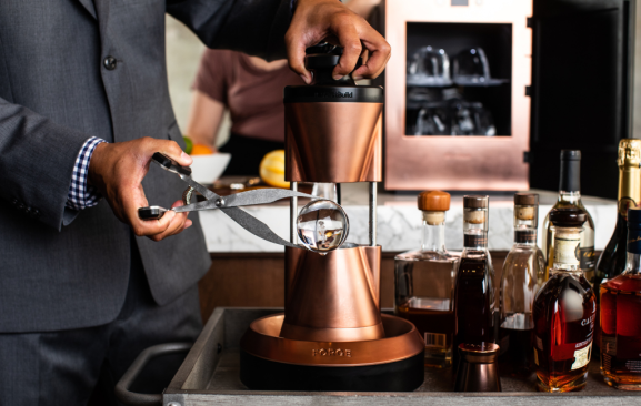 The perfect ice cube. Monogram demonstrates how a new specialty product will deliver an unmatched sipping experience via the Forge heated sphere ice press. A product of FirstBuild, the innovation incubator and co-creation community of GE Appliances, Forge was designed for use in the homes of bourbon connoisseurs and by professional bartenders and mixologists. (Monogram Design Center Chicago, Suite 124)