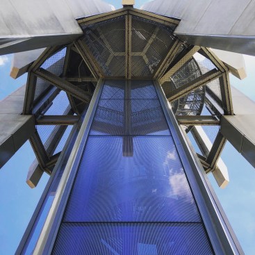 A glass-enclosed spiral stair provides access to the console room (from which the carillon is played) and a microclassroom located part-way up the tower. 