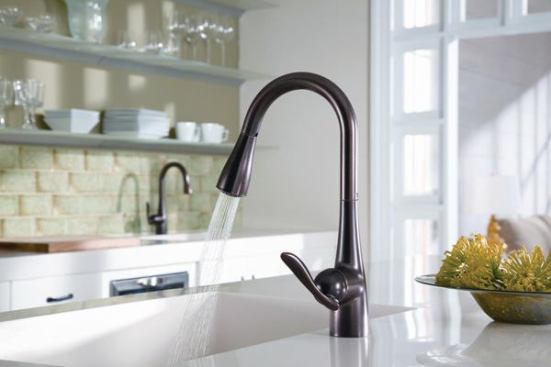 Moen. Engineered to swivel, retract, and dock effortlessly, the high-arc Arbor pull-down faucet now comes with Reflex technology, requiring less force to extend than previous systems, the company claims. The hose weight has a slight football shape to bounce off pipes beneath the sink and prevent hang-ups. The flexible hose and ball-swivel joint create a wider range of motion when aiming the spray. 800.289.6636. www.moen.com/reflex.