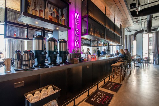 Instead of having a separate check-in desk, guest services are provided at the bar area in the lobby of the Moxy Hotel in Columbus, Ohio.