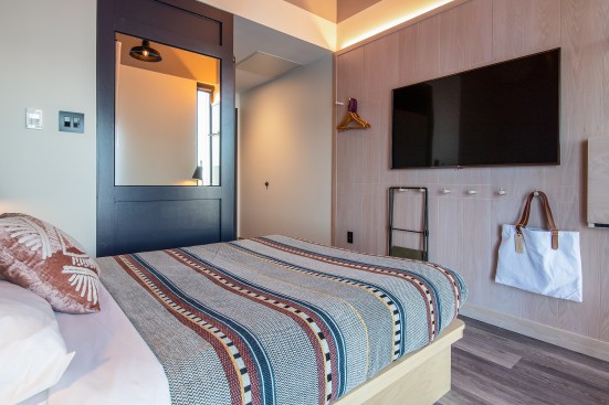 Guest room were kept small to encourage guests to spend more time in the public areas. It's an approach to hospitality design that echoes some of the spatial trends of cohousing.