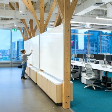 Work areas with whiteboards double as acoustical barriers