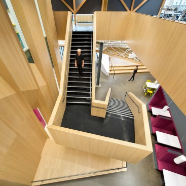 Social and breakout areas around the base of the communicating stair encourage employee interaction