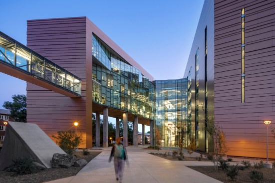 View of central courtyard with articulated curtainwall, looking south into the atrium and lobby