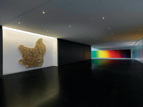 Below grade, along the axial campus-circulation spine, a subterranean space leads to the exhibition galleries.