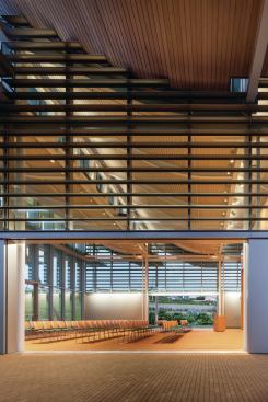 The community room can be opened to the fresh air on two sides, and can be reconfigured to house multiple types of events.