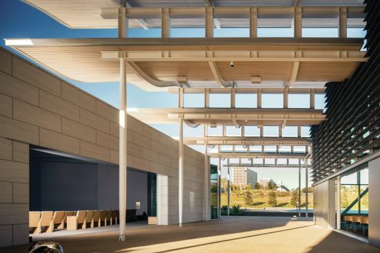 At the north end of the complex are the council chamber (shown left) and community room (right), which are connected by a covered porch. The permeability of the community room reflects the overarching idea “that you can have activities and engage people by not having them funnel through a stuffy formal building,” says Gregory Mottola, AIA, principal-in-charge of the project. “The light bulb really went off for the city about how they could use this space.” 