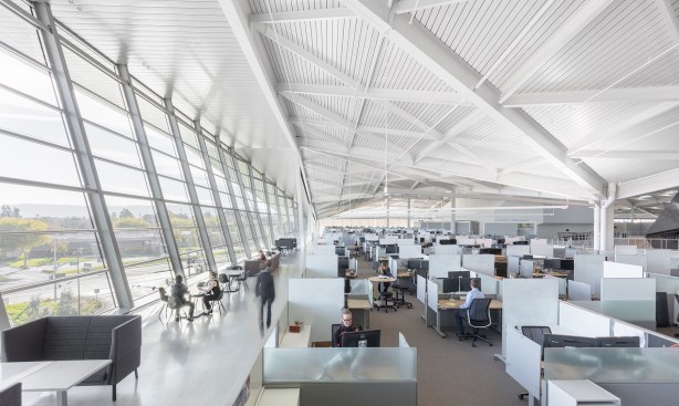 The uplights suspended from the structural beams throughout the project also help to mitigate high
contrast ratios, making the space visually comfortable and glare free.
