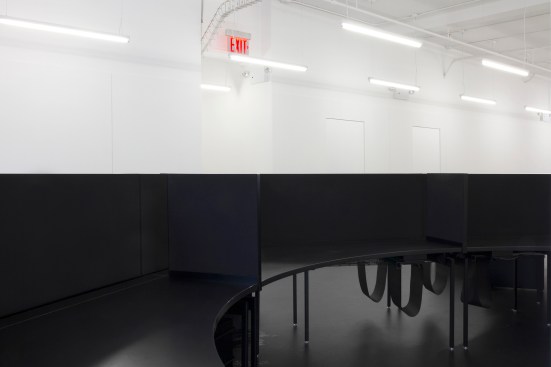 Located in New York City, this office accommodates three separate companies and features stark color blocking.