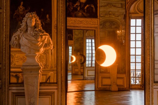 “Deep Mirror (Yellow)” and "Deep Mirror (Black)" reflecting off of each other to achieve the infinite repetition of crescent shapes.