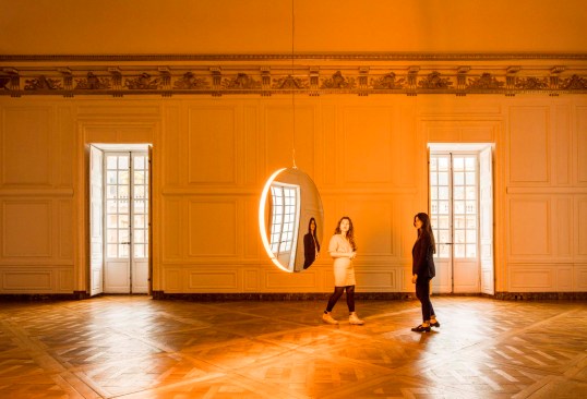 Eliasson's "Solar Compression" appears to float while lighting up a bare room inside the Palace of Versailles.