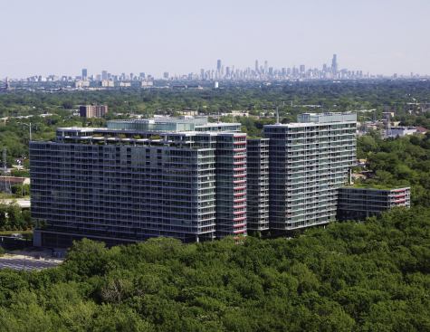 The towers are clad entirely with an aluminum and-glass curtain-wall system crafted by Chinese company PD Manufacturing International. The system has integral sunshades (like the two-tiered red aluminum panels on windows on some south and west façades) to offset glare in a neighborhood where the only sources of shade for each tower are the other two towers in the complex.