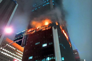 The First Interstate Bank Tower in Los Angeles, Calif., was not protected with a perimeter fire containment system and subsequently suffered a fire in 1988. The above image shows the fully engaged fire spreading through several floors via the interior joint at the perimeter of the building.