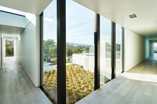 Windows in the second-floor corridor overlook the courtyard and driveway.