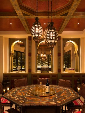 Integrated fixtures highlight the wine casework and mosaic wall, and silhouette and provide soft lighting for the wine bottles.