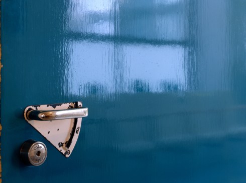 Patient room door, designed so that it wouldn't catch on doctors' lab-coat sleeves