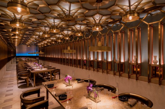 Private dining room with pendants descended over table, the Peacock Room restaurant