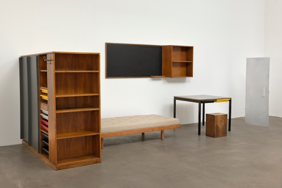 Another view of the dormitory furnishings from the Maison du Brésil by Charlotte Perriand, which are made out of wood, tubular steel, plastic, formica, fabric, and aluminum.