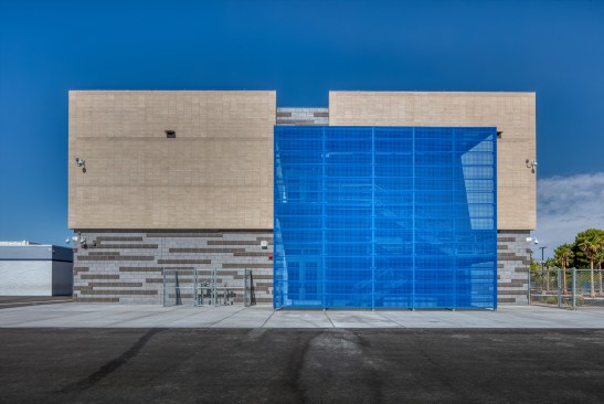 Perforated aluminum HWP panels provide a screen for the exterior staircase.
