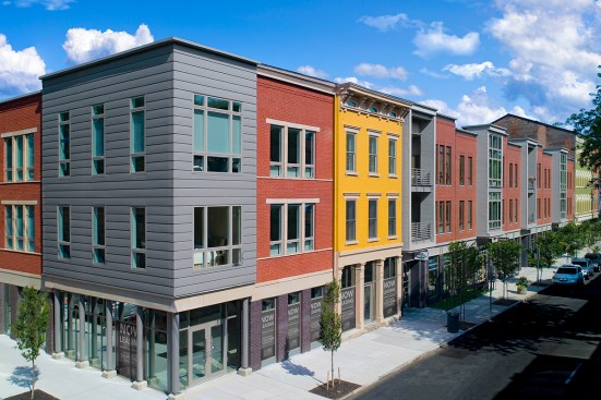 Wrapping the window bays and corners in metal adds a contemporary feel to the Rennen & Beecher Flats, a new mixed-use project in the historic Over-the-Rhine neighborhood of Cincinnati.