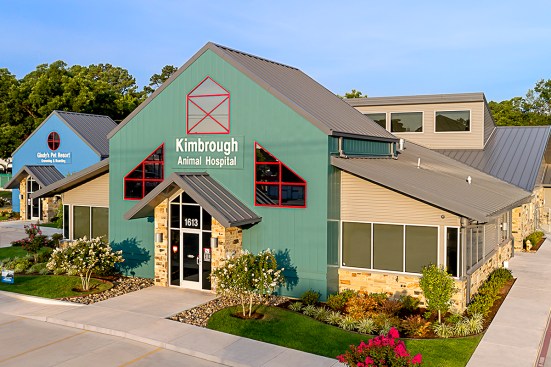 Kimbrough Animal Hospital, located in Longview, Texas, is clad in flush and ribbed panels, along with a metal roof. The barn-inspired exterior uses a mix of panels and colors to provide a durable, welcoming facility.