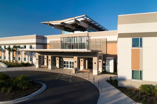 In Ponte Vedra, Fla., Baptist HealthPlace at Nocatee takes advantage of durable metal panels with a woodgrain finish to add visual interest to the main entrance, soffits, and accents between windows.