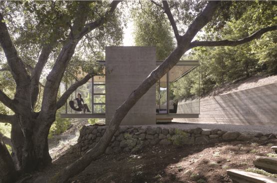 Designed to offer its owners a quiet spot for peaceful contemplation, this om-inspiring structure uses simple forms and materials to magnificent effect. The steel-framed glass box is anchored by a U-shaped concrete base, over which the structure cantilevers out into a grove of California oaks. 
Architect: Swatt|Miers Architect, Emeryville, Calif. 
Builder: Neto Builders, Los Gatos, Calif.  This building was also selected as 
project of the year for the 2010 residential architect design awards.