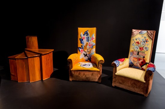 A telephone fan table (1924) and two high-backed chaffeuses (1925) designed by Chareau