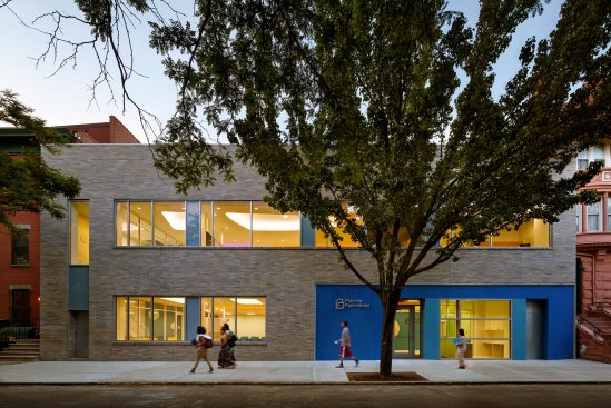 The building's new facade features large windows to let natural light into the interiors.