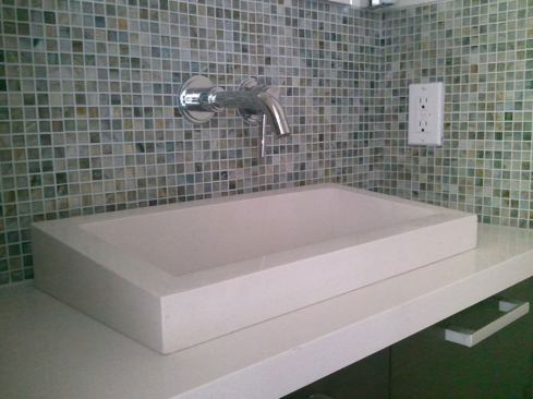 Baths contain glass tile backsplashes, Caesarstone countertops, WaterSense fixtures, and Toto dual-flush toilets.