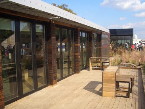 A wide deck, made from locally grown black locust, extends the home’s living space far beyond its interior footprint. The tri-fold doors from Solar Innovation feature double-pane, argon-filled glass. The Cambia heat-treated poplar does not require treatment for protection against weather and insects; gaps in the cladding and a rainscreen protect the building envelope.