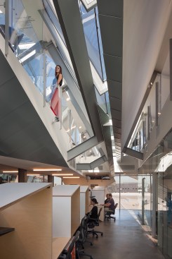 The more fragmented floor plate of the upper office level offers the opportunity for double-height spaces.