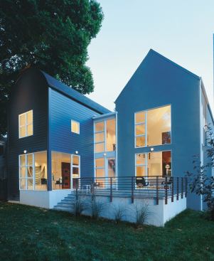 Gabled and curved roofs slide past each other, creating an abstract composition and reflecting the division of public and private space.