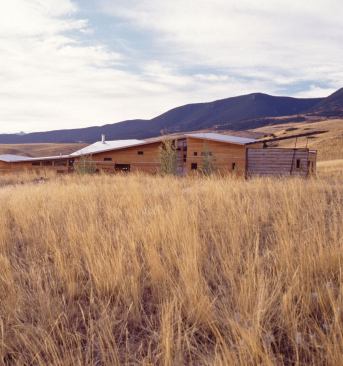 Residential Architect  June 2007  In the Middle of Nowhere   Alongside the unpaved road to Lori Ryker and Brett W. Nave's home and studio, alpacas and horses nibble placidly at the surrounding grassland. Dusty pickup trucks drive well under the posted speed limit of 35 miles per hour. The Livingston, Mont., compound is so remote, its exact street address doesn't show up on MapQuest.