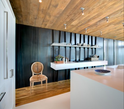 Kitchen with folded steel wall panel