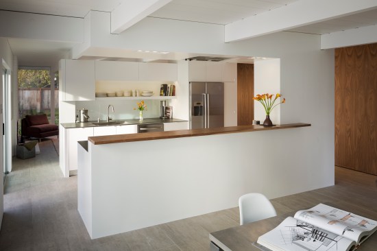Inside the home, contractor Stephen Shoup's biggest project involved replacing the kitchen with one that could be accessed from both ends and that was more open to the dining room in front of it and the living room behind.