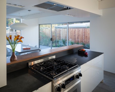 The view from the kitchen to the dining room. The floor-to-ceiling glazing at the front of the dining room is new.