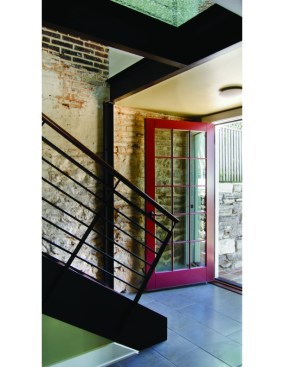 New entrance to one of the two apartments in which the entrance area has been stripped down to the original masonry.