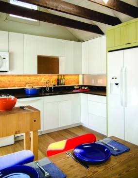 By taking up part of the old attic, the kitchen in the new Cork Street apartment gained extra inches.